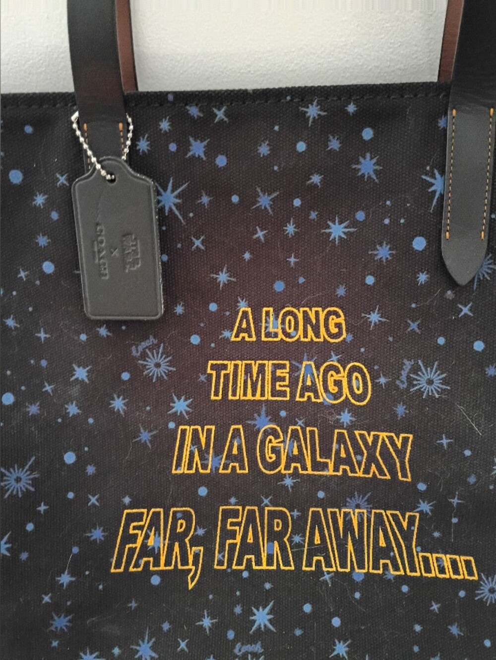Coach Black Canvas Tote with Blue Star Print and Yellow Text